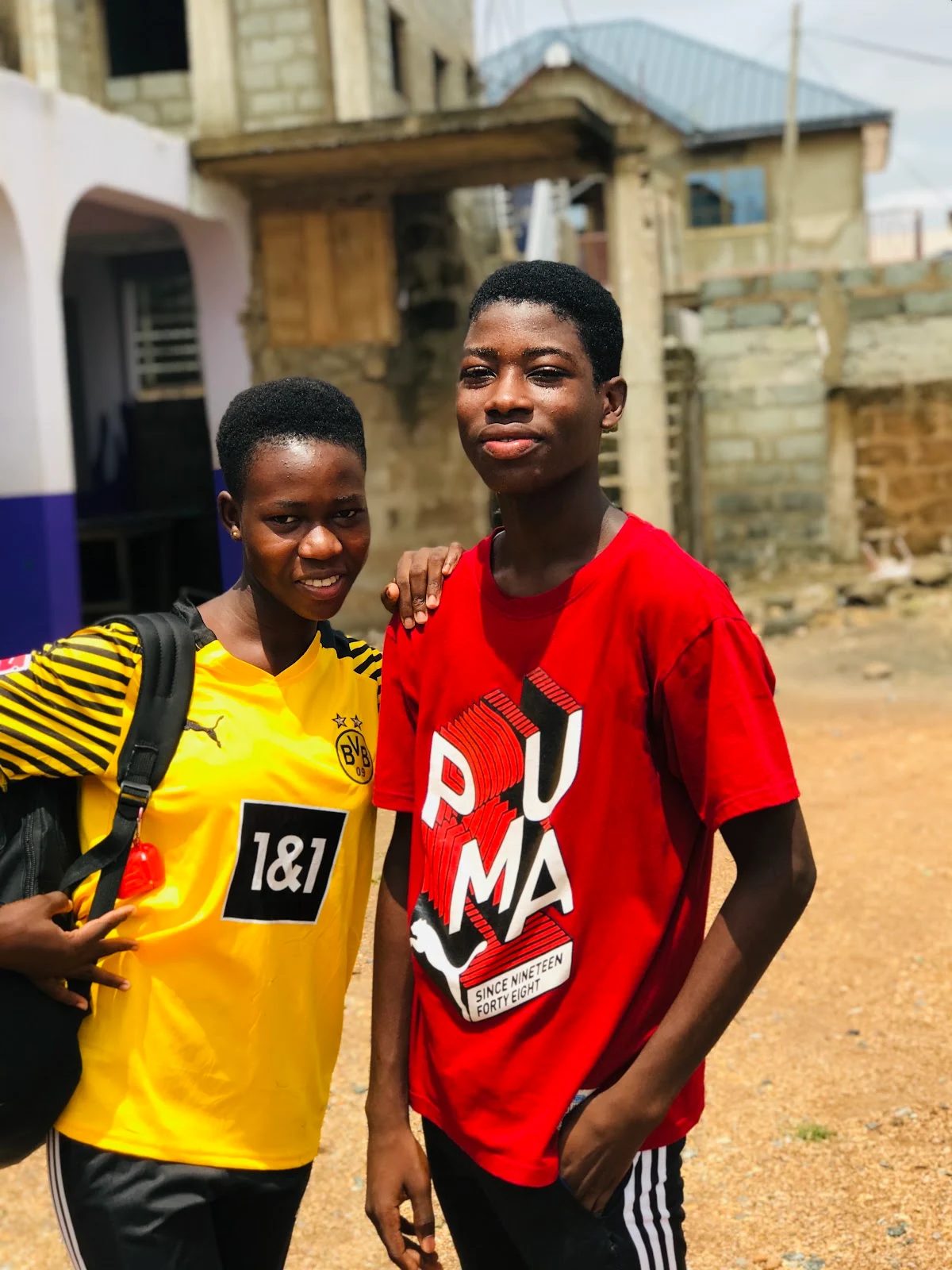 Two Macvak students smiling on campus